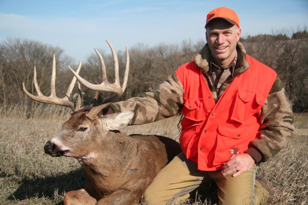Trophy Photo of a Hunter with a large whitetail deer