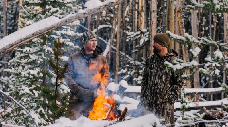 Hunters by a fire