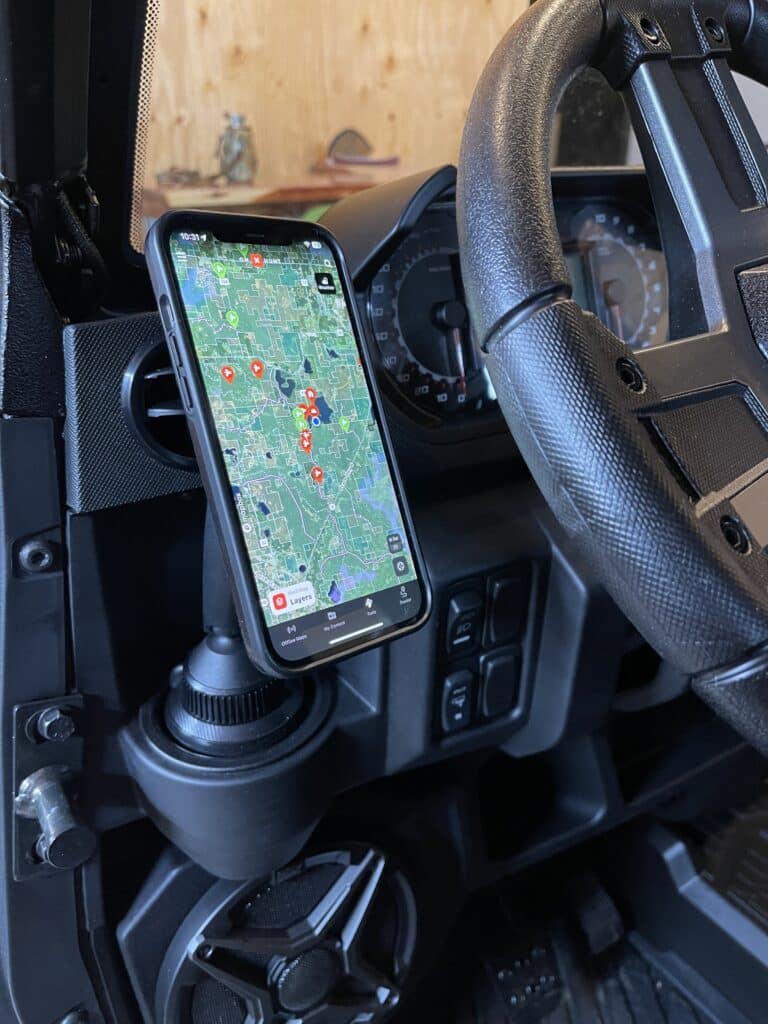 onX Hunt on phone in utv